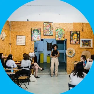 Students listening to a talk in a community space